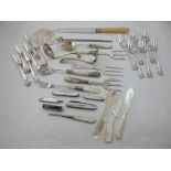 Assorted mother of pearl handled utensils including berry spoon, serving forks,