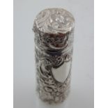 A Victorian style white metal cylindrical scent bottle,