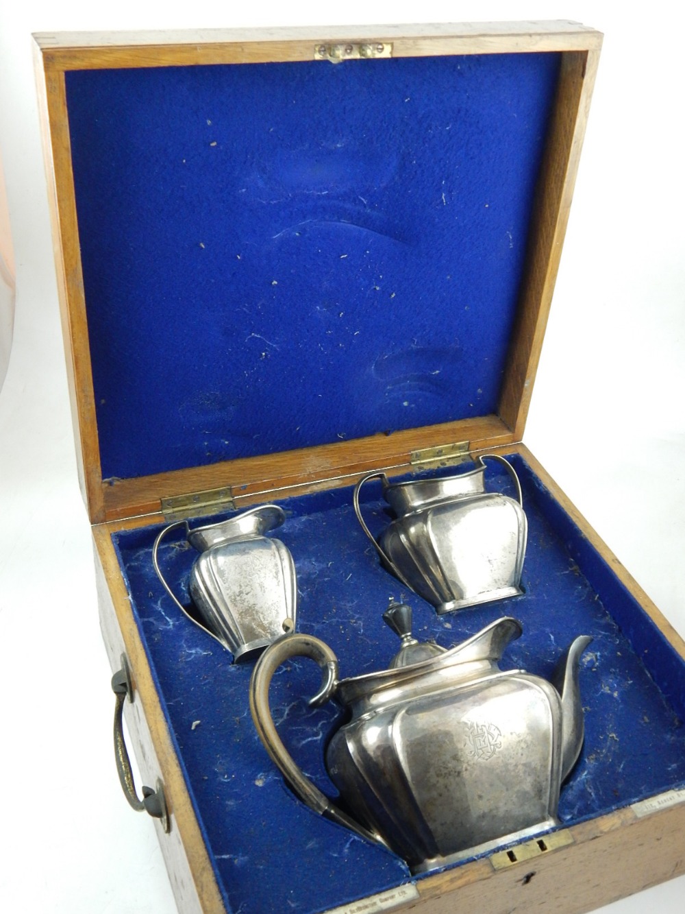 A three piece silver tea set, London 1903, having gilt washed interior,
