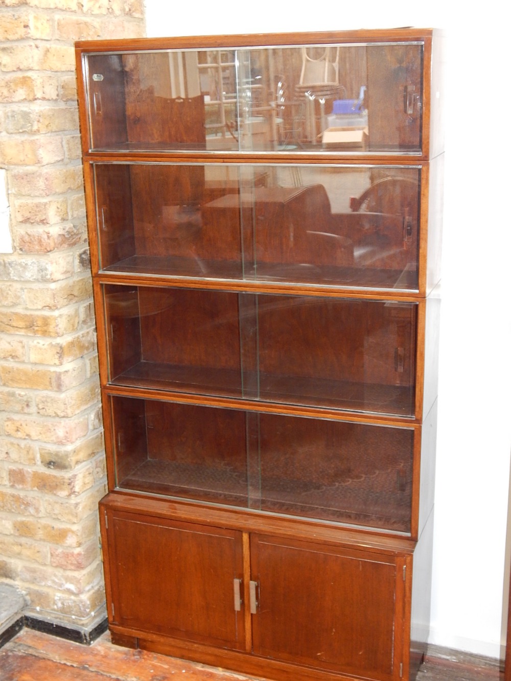 A 1950's Minty five section glazed walnut bookcase, W.