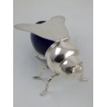 A novelty silver plated and blue glass honey pot in the form of a bee,