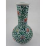 A Chinese doucai baluster vase, decorated with flower heads and scrolling foliage,