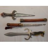 Three various novelty swords.