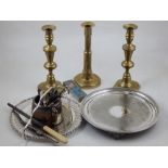 A quantity of silver plated items, together with a pair of brass candlesticks.