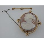 A yellow metal mounted cameo portrait brooch, indistinctly stamped 9c,