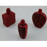 A red lacquer snuff bottle, the incised decoration showing figures,