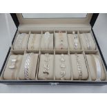 A quantity of twelve white metal bracelets, of various design,