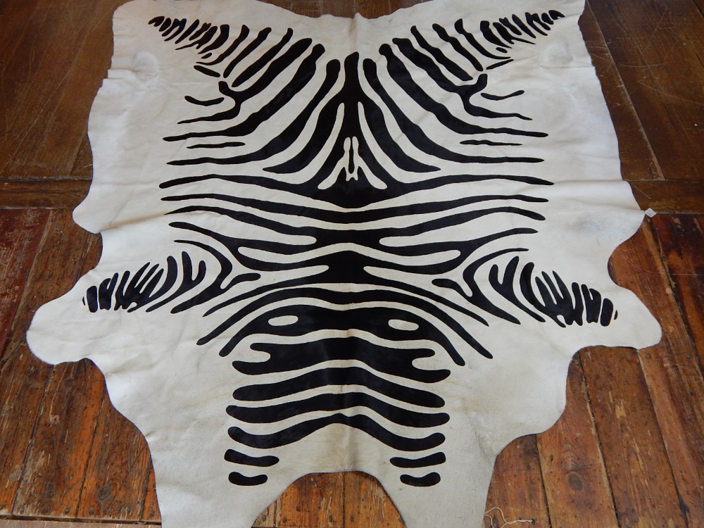 An unusual cow hide dyed with zebra markings.