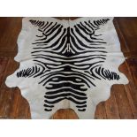 An unusual cow hide dyed with zebra markings.