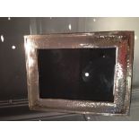 A white metal rectangular photograph frame, having spot hammered decoration, stamped 925.