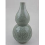 A 20th century Chinese celadon double gourd vase. H.