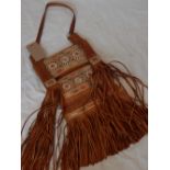 A brown leather tribal tote bag,