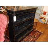 An early 20th century ebonised open bookcase, with an arrangement of adjustable shelves,