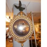 A late George III convex wall mirror,