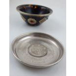 A faux tortoiseshell and white metal decorated bowl,