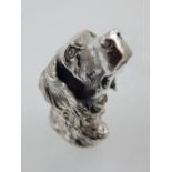 A novelty white metal vesta case in the form of a dog's head,