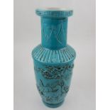 A Chinese turquoise ground vase of rouleau form, decorated with horses, bamboo and mountains,