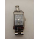 A ladies Baume & Mercier stainless steel wristwatch the rectangular dial with partial Arabic