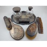 A silver dressing table set, London 1919, Mappin & Webb, engraved with foliate swags,