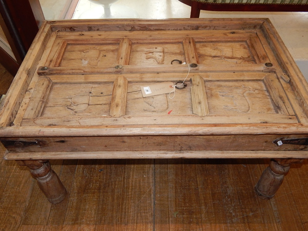 An unusual pine panelled coffee table,
