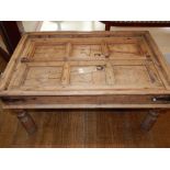 An unusual pine panelled coffee table,