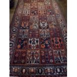 A Bakhtiari rug, decorated with square panels of stylised floral design,