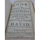 The Book of Common Prayer, 1743, by Baskett, full calf binding, spine detached.