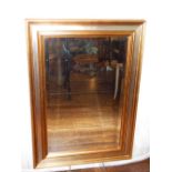 A modern rectangular gilt and silvered frame bevelled wall mirror, H.