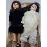 An early 20th century Schoenau and Hoffmeister celluloid doll with sleeping eyes,