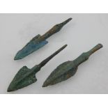 Three bronze arrow heads