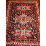 An indigo ground silk Shiraz wall hanging rug, decorated with stylised floral and zoomophic design,