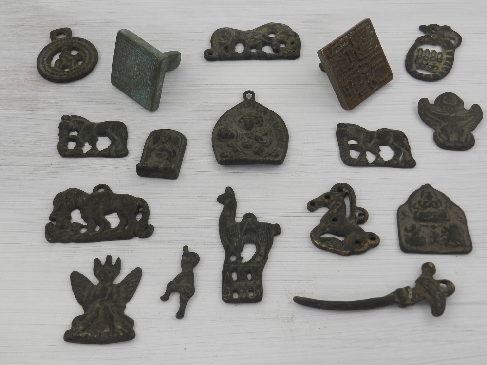 A collection of bronze items, to include mounts,