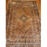A honey ground silk North West Persian rug, having dimaond shaped medallion to centre,