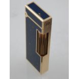A gilt metal and lapis style Dunhill lighter.