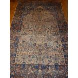 A blue ground Isfahan rug, decorated with floral mirab shaped medallion to centre, L. 216cm, W.
