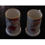 A pair of 20th century Spode spill holders, of cylindrical form and decorated with flowers, H 10cm,