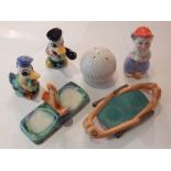 A vintage golf-themed ceramic cruet together with another modelled as ducks, (2).