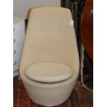 An unusual 1970's Heals swivel egg-shaped tub chair, upholstered in original cream fabric. H: 90cm