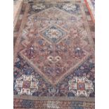 A Qashqai carpet, decorated with stepped medallion and geometric design to centre,