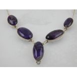 A white metal and amethyst drop pendant necklace, set five large oval cut amethysts,