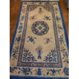 Three Chinese cream and blue rugs, of floral decoration, fringed, largest L.