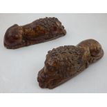 A pair of cast stone paperweights, modelled in the from of recumbent lions, L. 21cm, (2).