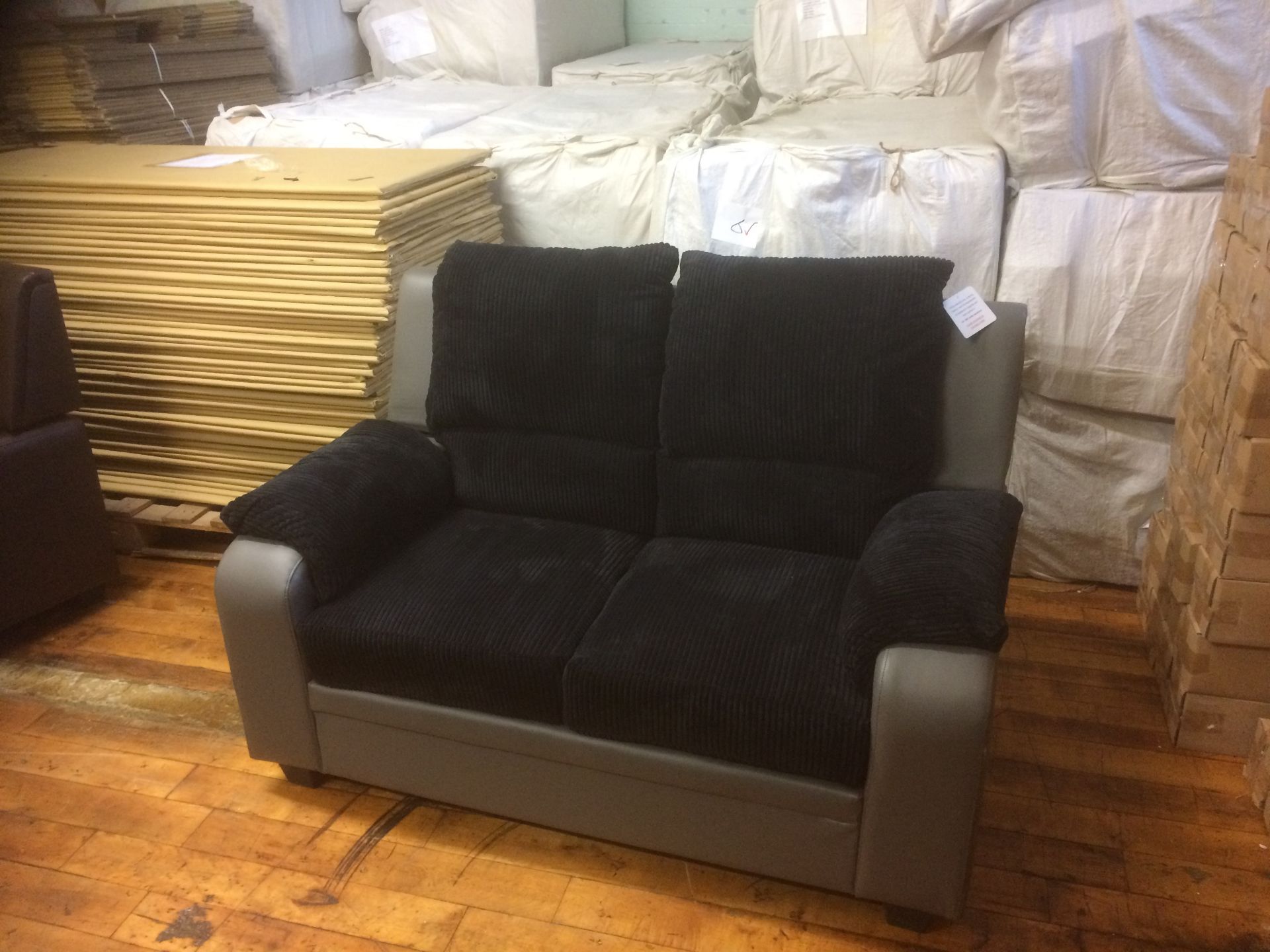 Black/Grey Faux Leather/Fabric Sofa - Two Seater (Brand New)