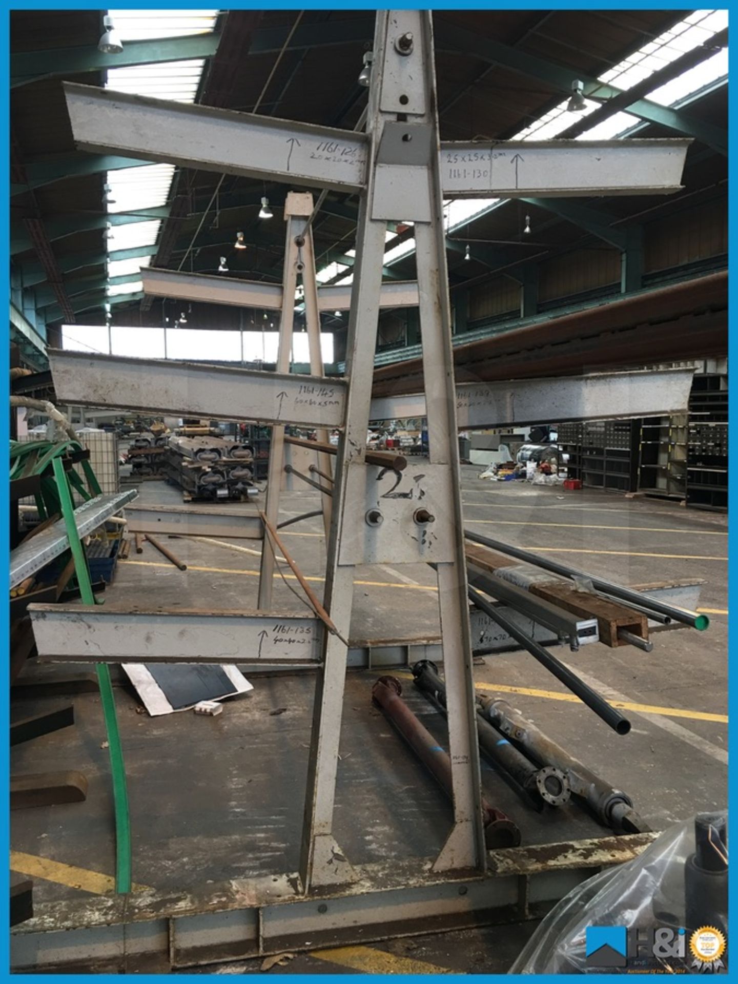 Large steel construction material rack with 3 arms. Approx 9ft x 6ft x 9ft high Appraisal: Viewing