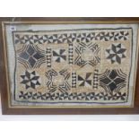 A piece of Tapa cloth, framed and glazed