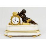 A French mantel clock with white enamel dial, striking movement on a bell, in a gilded ormolu case