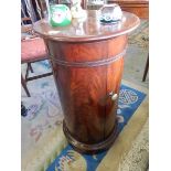 A Victorian mahogany cylindrical pot cupboard, on circular base