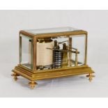 A barograph in a gilded bronze and bevelled glass case - 8 1/2in. wide