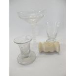 A Masonic glass with engraved bowl and cotton twist stem, four other Masonic glasses and an