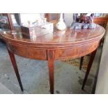 A Georgian mahogany and satinwood crossbanded tea table with half round folding top, on square